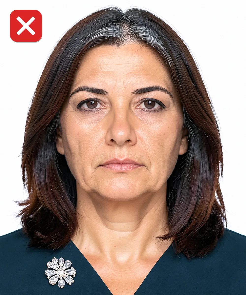 Passport Photo in Bağcılar — Incorrect ID photo: large sparkling brooch on the collar
