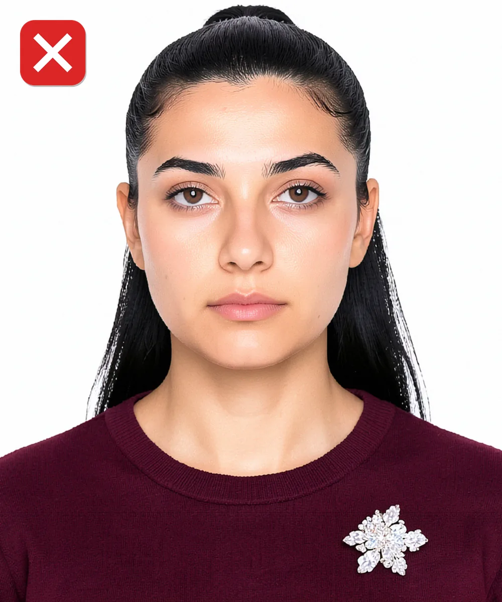 Passport Photo in Pendik — Incorrect ID photo: large sparkling brooch on the collar