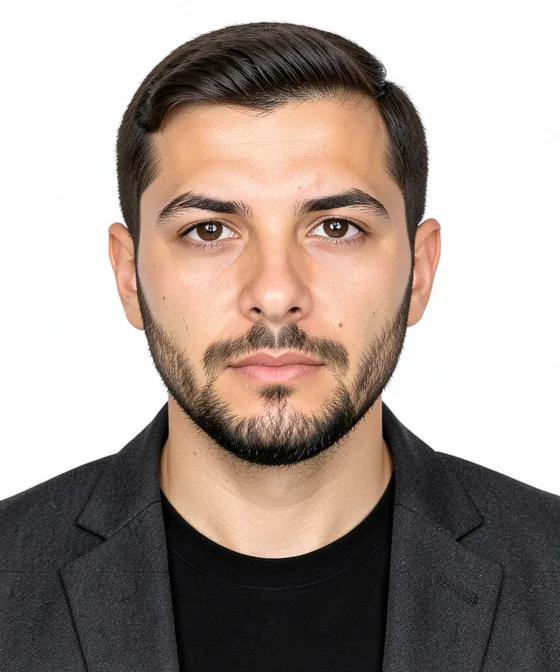CV Photo — Correct corporate portrait: natural closed-mouth smile, eyes on the camera, head-and-shoulders framing, light grey background